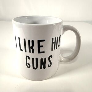 White Ceramic Mug with Black Text "I LIKE HIS GUNS"